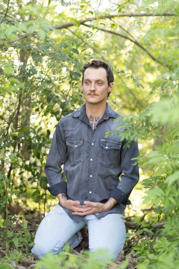 Nick Dearman outdoors in a quiet contemplative moment