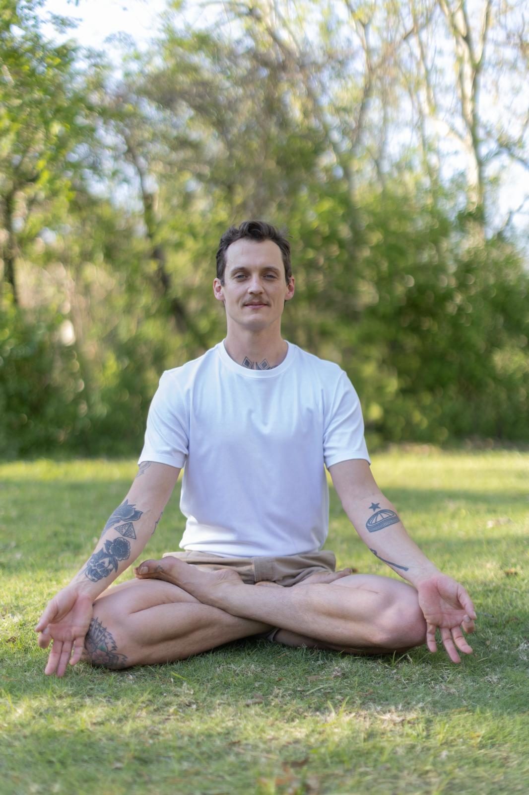Nick Dearman seated in meditation outdoors